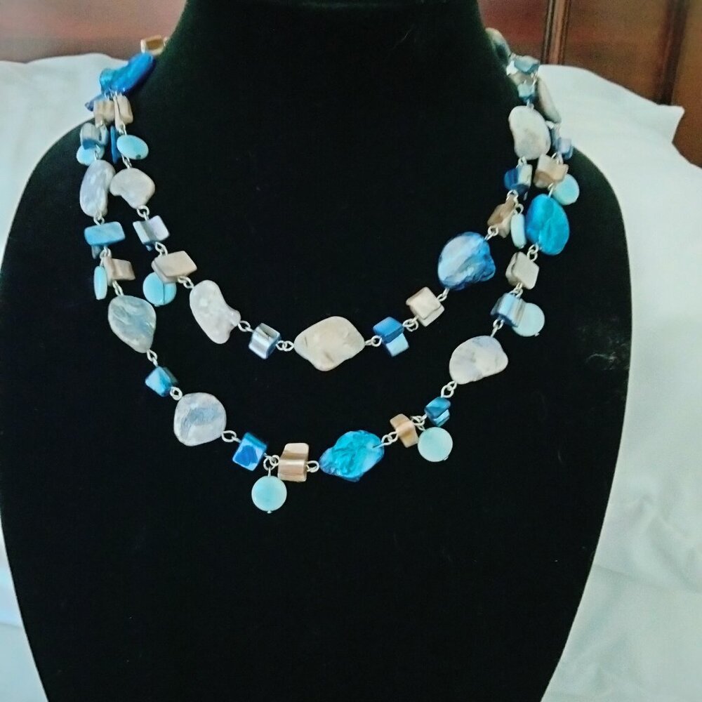 Necklace with blue stones and small brown stones mixed in